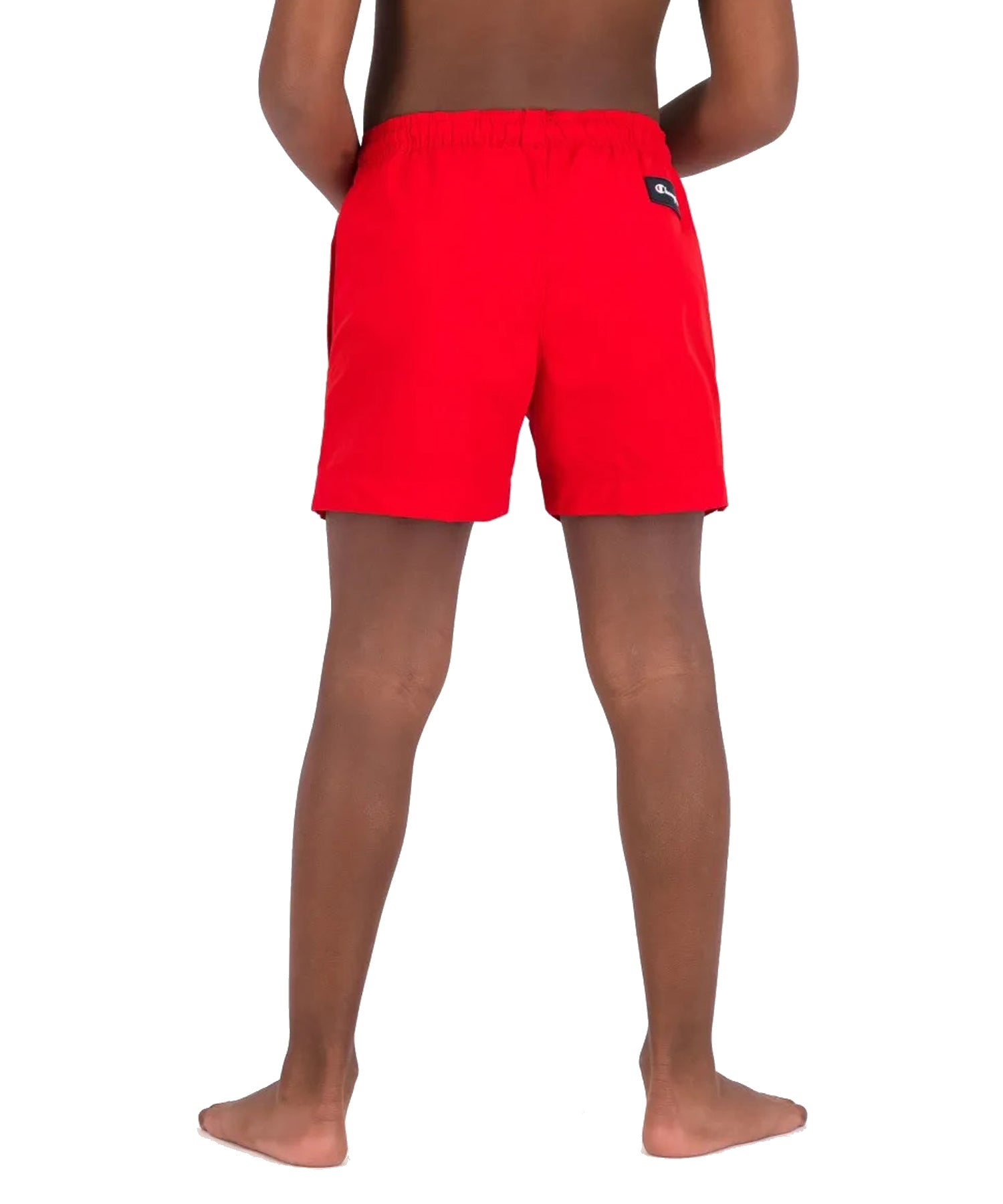 Bañador para niños Champion de color rojo con logo Champion en la pierna.