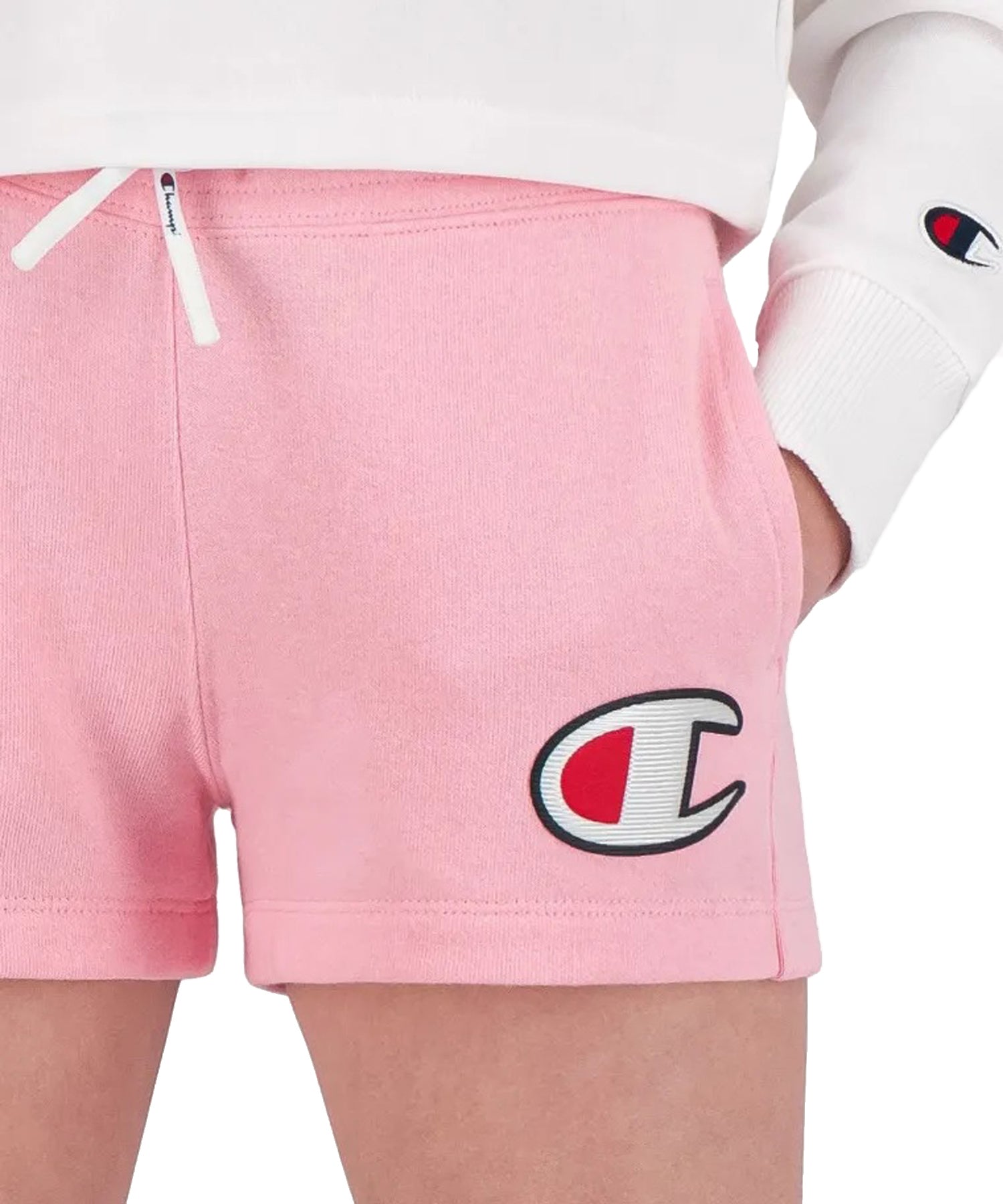 Shorts Champion color rosa para niña con logo Champion en la parte del muslo-tela de felpa de algodón para mayor comodidad.